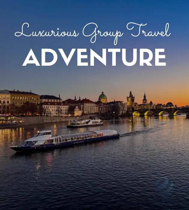 Sunset river view with boats, illuminated bridge, and historic cityscape promoting luxurious group travel adventure.